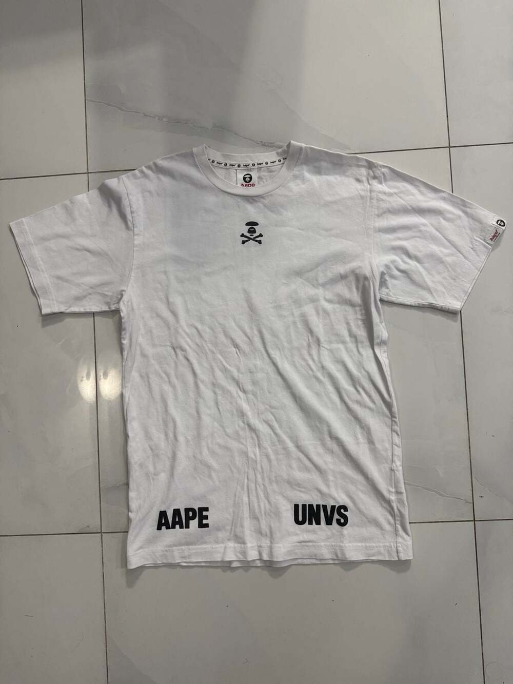 Aape by A Bathing Ape AAPE UNVS Skull and Crossbones Graphic T-Shirt
